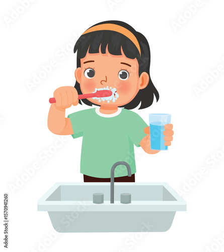 Little girl brushing teeth with tooth brush for dental care 