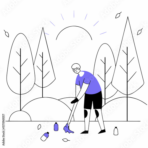 Young man picking up litter in forest with sun in background