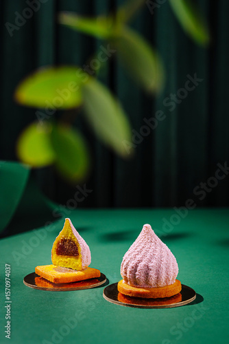 Exquisite dessert display featuring colorful confections on a green surface