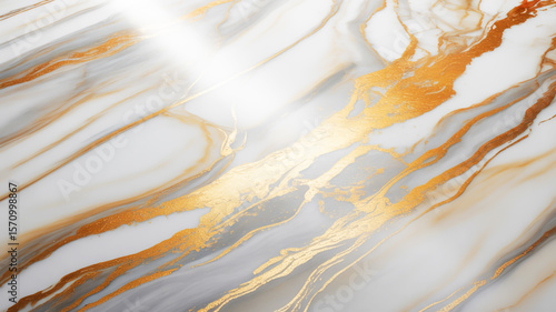 A luxurious abstract marble pattern with flowing white and gray veining accented by brilliant metallic gold streaks