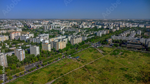 Fotografija Soviet-era apartment blocks and green empty space on city outskirts
