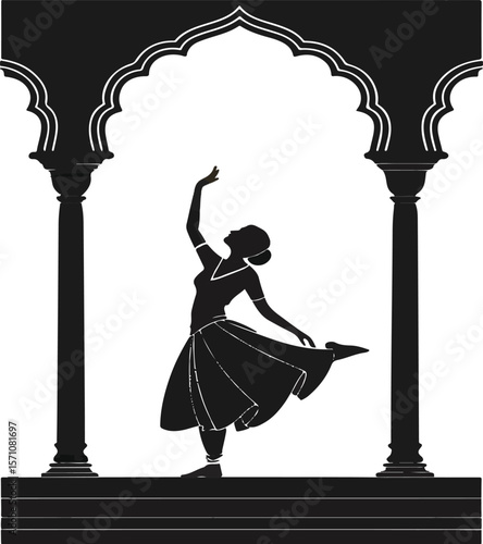 Silhouette of a graceful indian dancer performing underneath an archway in black and white