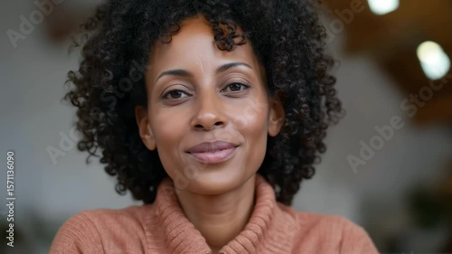 Wallpaper Mural Woman smiling and engaging with camera in cozy indoor setting with warm lighting Torontodigital.ca