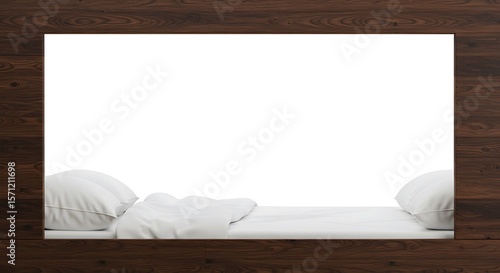 A bed with white linens and pillows is framed by a dark wood border, creating a blank space.