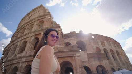 Tourist Smiling in Front of the Colosseum in Rome
