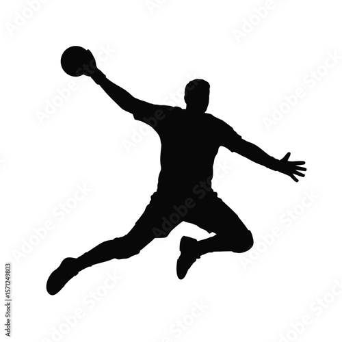 Silhouette of a handball player jumping and throwing the ball during a game
