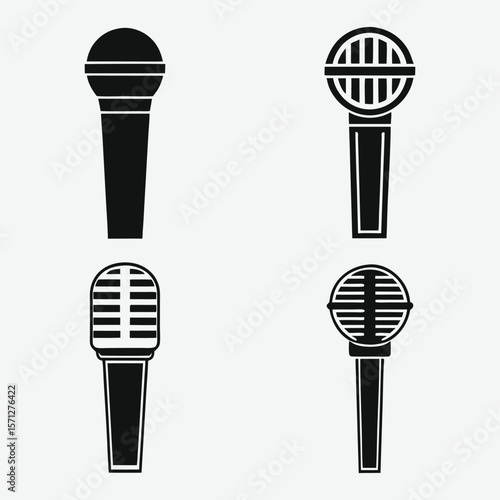 A collection of four microphones is displayed in black and white isolated on white background.