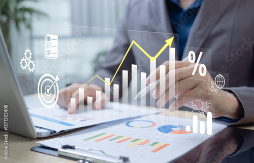 Businessman analyzing profit and quality management concepts long term cost planning, product quality, budgeting, financial forecasting, and company revenue and expense projections.