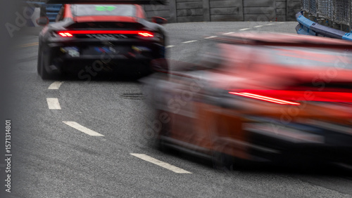 Foto Motion blur race car racing on speed track, Motion blurred super car race on str