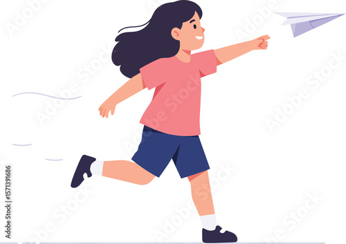 Child playing with paper airplane outdoors running happily wearing casual clothes and sneakers