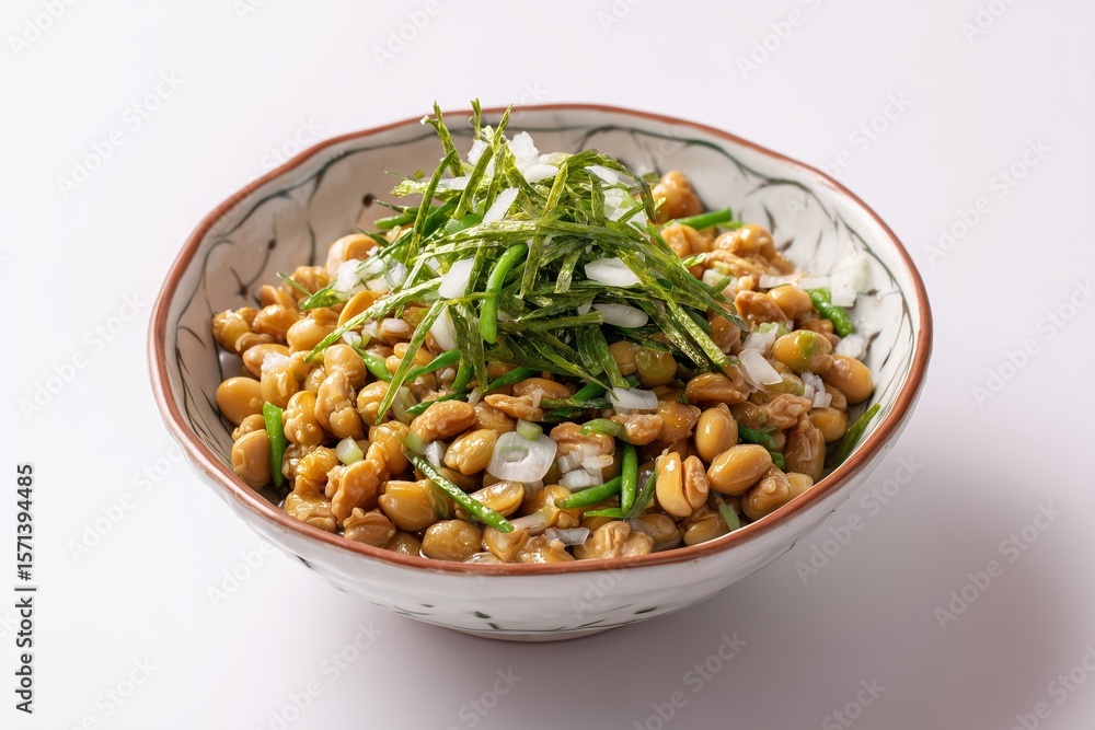 Natto salad featuring fermented soybeans with green onions and seaweed on a minimalist white background, perfect for a healthy meal Natto salad featuring fermented soybeans with green onions and seaweed on a minimalist white background, perfect for a healthy meal