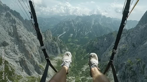 Paragliding over a mountain valley.