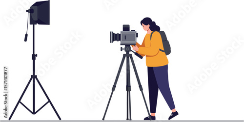 Female photographer adjusting camera on tripod with studio light in minimalist setting