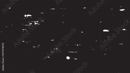 Abstract black and white image featuring a textured surface with scattered light spots pattern