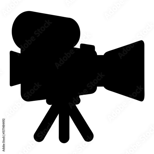 Silhouette of vintage film camera on a tripod representing old movies