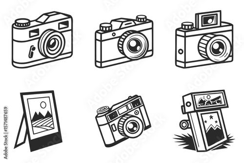 A collection of cameras and a framed picture isolated on white background