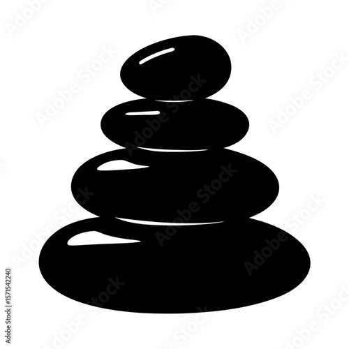 Four dark smooth stones carefully stacked in a zen inspired arrangement