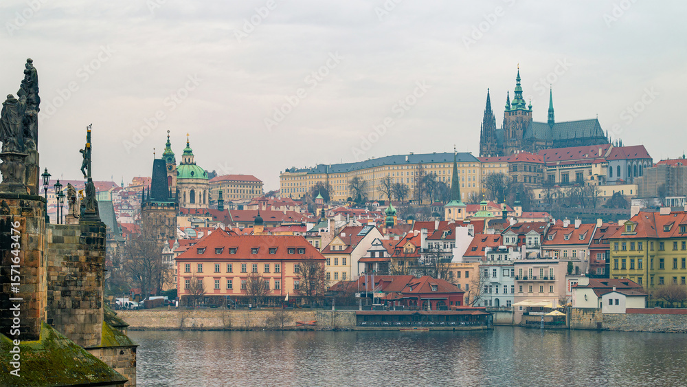 Obraz premium Prague, Czech Republic. Scenic view of Prague's iconic Charles Bridge with its historic arches and Baroque statues, overlooking the Vltava River and Lesser Town