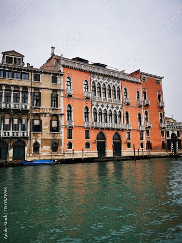 Beautiful historic architecture along the Grand Canal in Venice, Italy on a cloudy day
