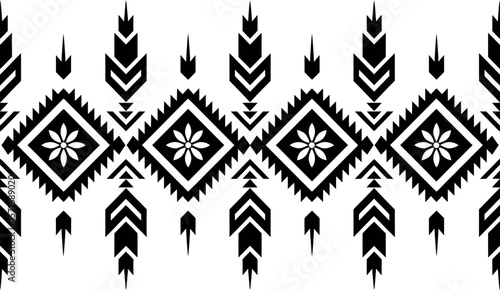 Black and white aztec pattern with diamond shapes and flowers in a seamless repeating design