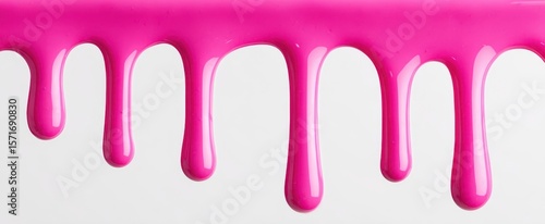 The vibrant pink paint dripping gracefully against a white background