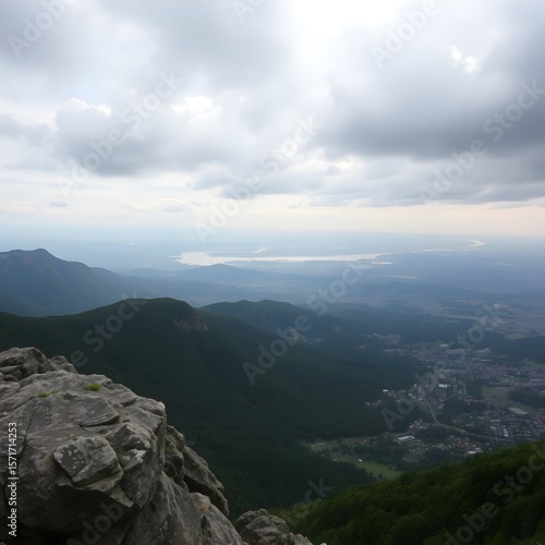 Contains a panoramic view of a mountainous landscape.