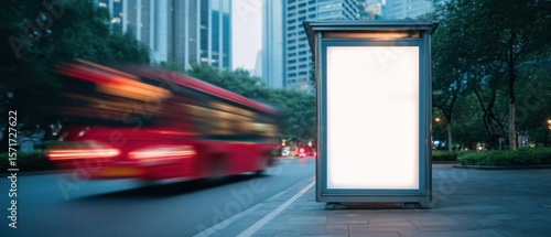 The bus stop in a bustling city with a blank advertisement space.