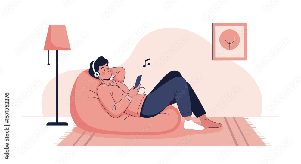 Fototapeta premium Relaxed Young Man Listening To Music On A Beanbag In A Cozy Room