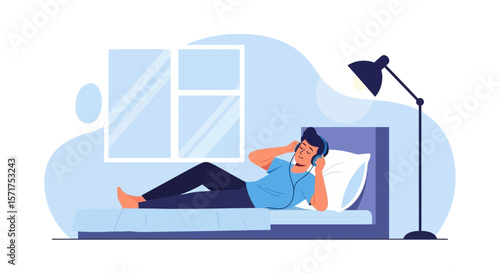 Man Relaxing In Bed Listening Music From Headphones In Bedroom