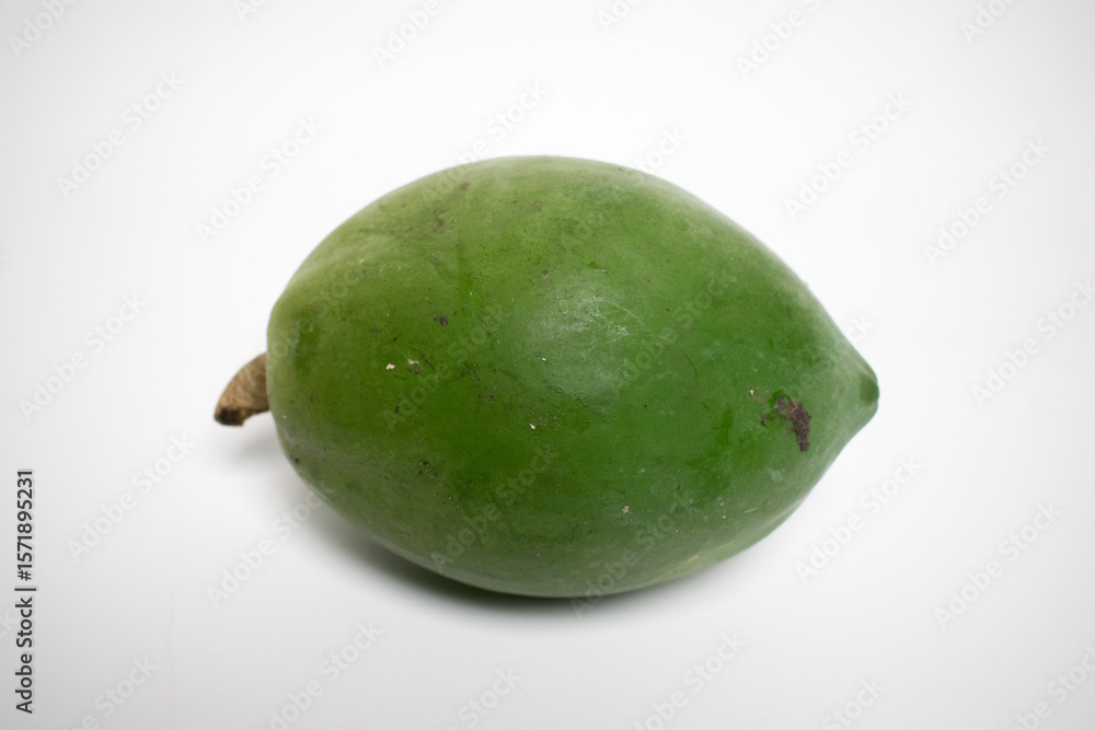 Green papaya fruit isolated on clean and bright background. Green papaya fruit isolated on clean and bright background.