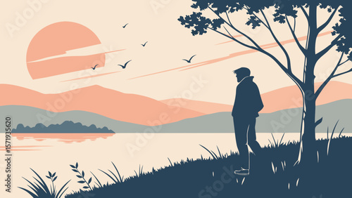 Man standing under a tree by a lake watching the sunset with birds flying