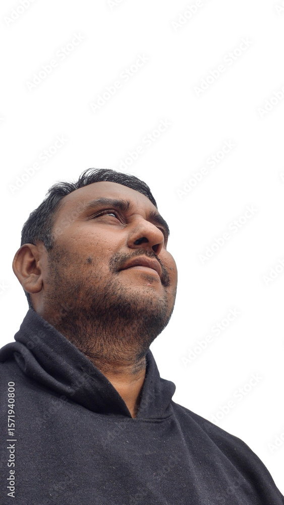 Obraz premium portrait of a man with a stubble beard looking up with a smile, casual and candid, pleasant expressions, smiling and looking in the distance, happy and content. transparent background. real people