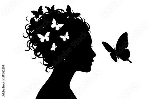 Silhouette of a woman with butterflies in her hair
