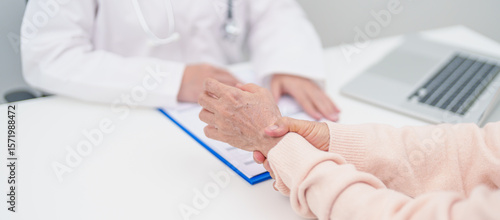 Elderly Patient Woman wrist pain and Consulting doctor. muscle ache from Carpal Tunnel Syndrome, De Quervain s tenosynovitis, rheumatoid, arthritis, gout, Parkinson disease and ergonomic healthcare