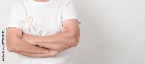 Wallpaper Mural Elderly woman with Peach Ribbon for September Uterine Cancer Awareness month, Endometrial Cancer, Gynecologic, Uterus and Ovaries, Endometriosis, June Vaginal cancer and World cancer day concept Torontodigital.ca