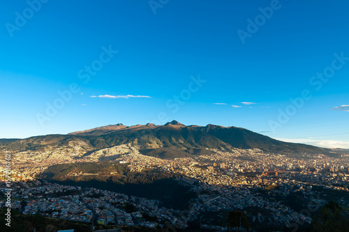 The city of Quito at dawn, nestled on the slopes of the Pichincha Volcano.