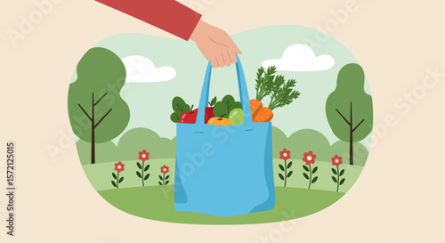 A hand holding a blue reusable bag filled with fresh groceries in a park.