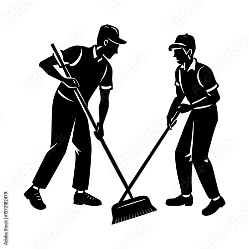Two sanitation workers sweeping with brooms in a black and white image