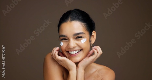 Canvas-taulu Beauty, portrait and girl with face cream in studio for collagen treatment, hydration and self care