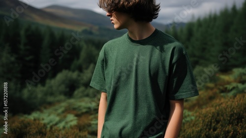 Person wearing forest green t shirt outdoors