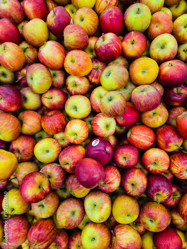 Heap of red delicious apples. Top view, background and texture.