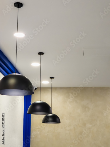 Ceiling lighting lamps hanging in modern cafe.