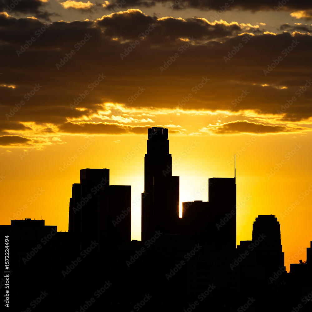 Naklejka premium Los Angeles urban skyline in silhouette at sunset