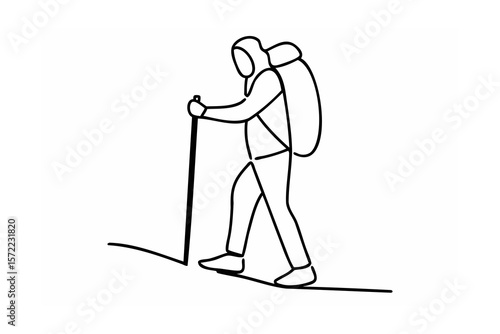 Hiker with backpack and trekking pole walking