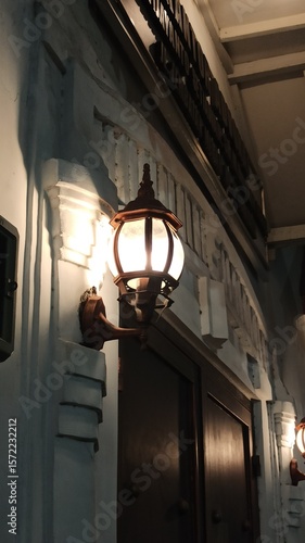 Decorative street lights glowing at night, creating a warm, peaceful atmosphere. Ideal for urban scenes, night photography, or festive street visuals