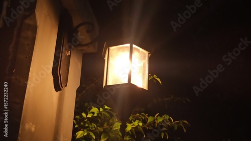 Decorative street lights glowing at night, creating a warm, peaceful atmosphere. Ideal for urban scenes, night photography, or festive street visuals