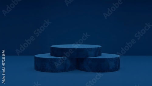 Three textured dark blue circular pedestals arranged in a stepped formation