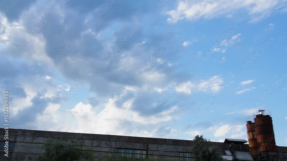The camera glides slowly across a landscape under a clear blue sky with soft clouds. Smooth motion creates a calm and immersive feel. Full HD video. The camera glides slowly across a landscape under a clear blue sky with soft clouds. Smooth motion creates a calm and immersive feel. Full HD video.