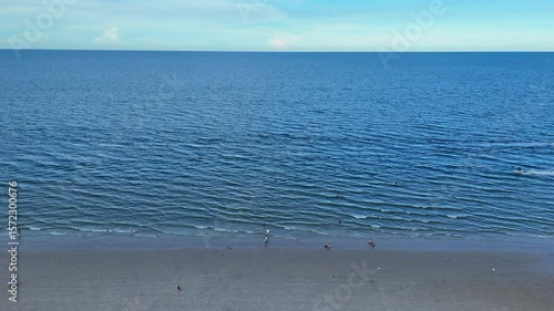 Quiet shoreline with clear water and open sky