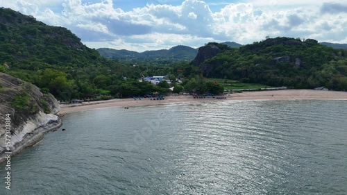 Thai coast with peaceful beach and jungle slopes